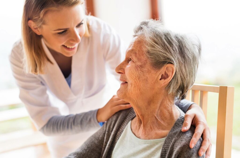 A nurse checking in on a nursing home resident.