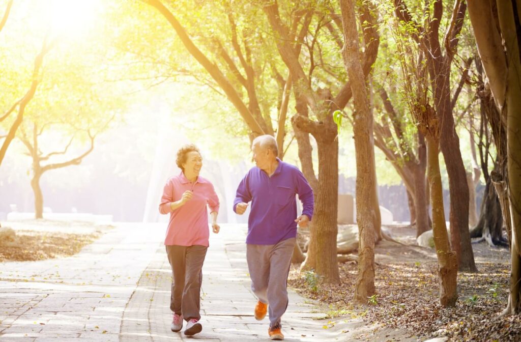 A happy senior couple starts their day with a brisk morning walk together.